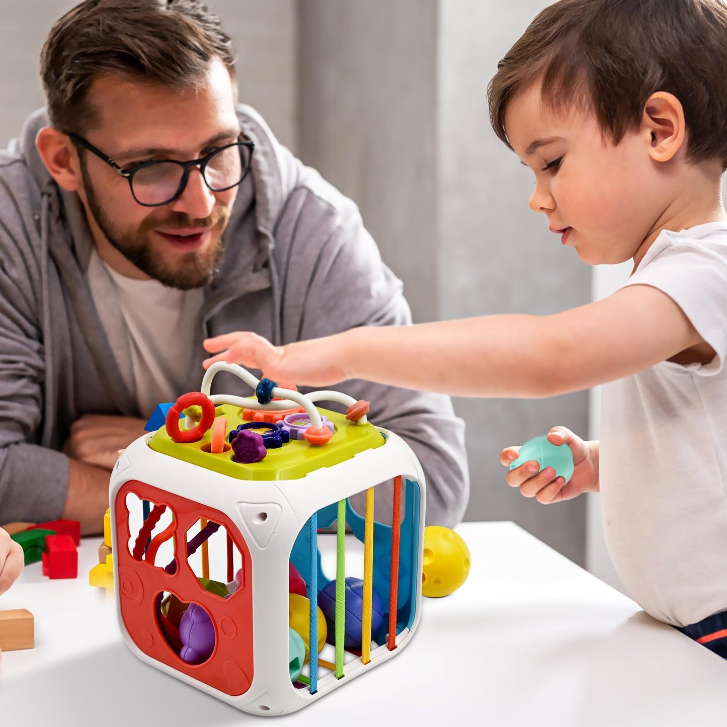 Montessori Babyspielzeug 7 in 1, Motorikwürfel ab 1 Jahr